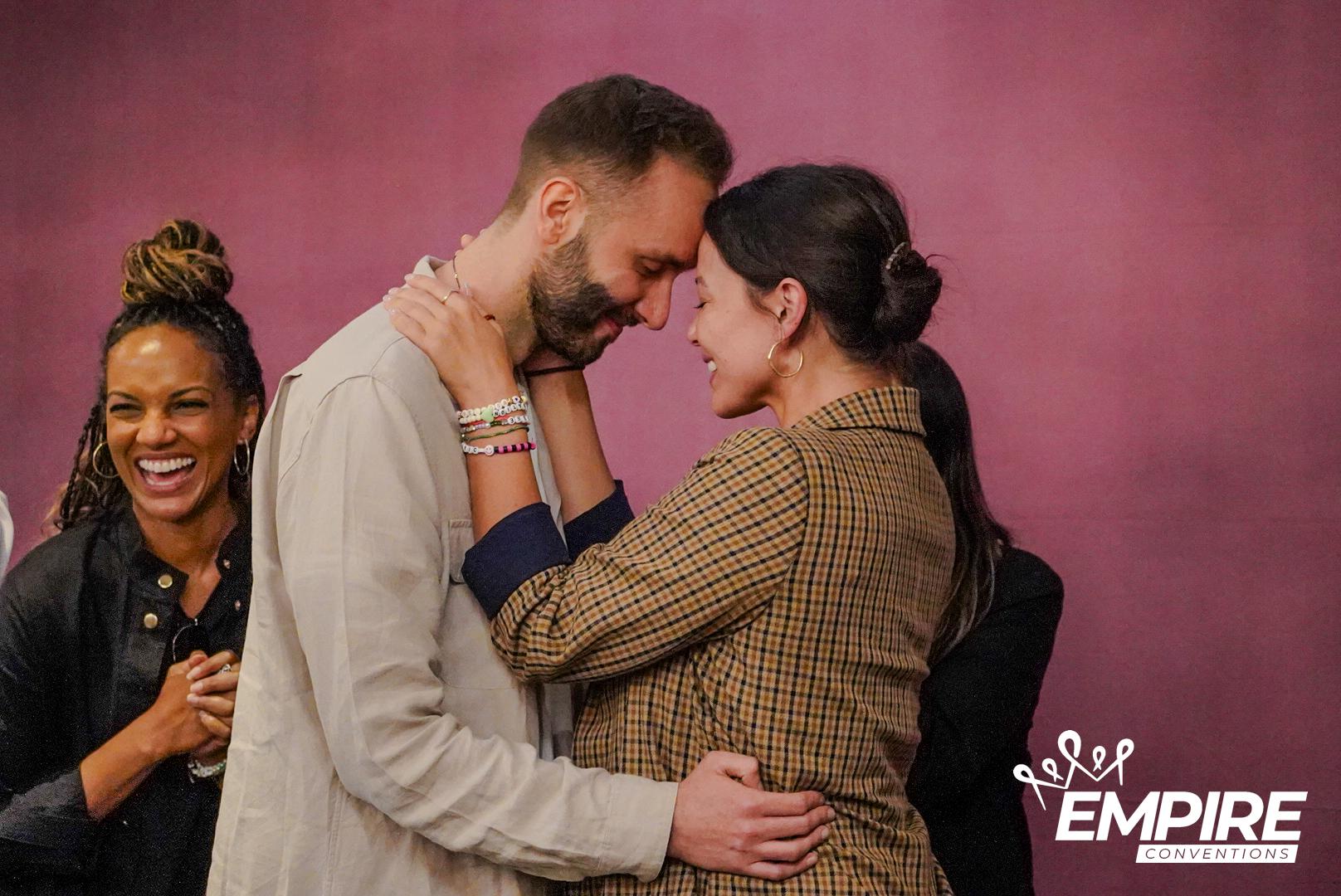 Close-up of the cast embrace during the photo op