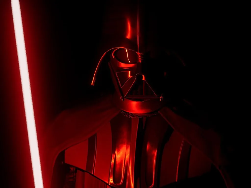 Dark helmet lit in deep red beside a glowing blade